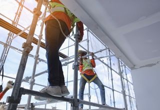Heavy multi-tier ringlock modular scaffolding structure wrapped around industrial plant column